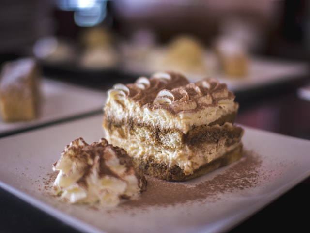 Slice of tiramisu with whipped cream