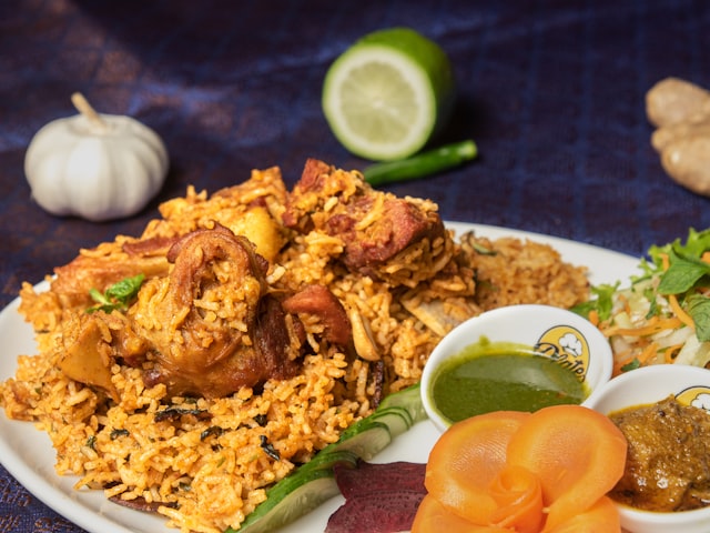 White plate of rice with vegetables
