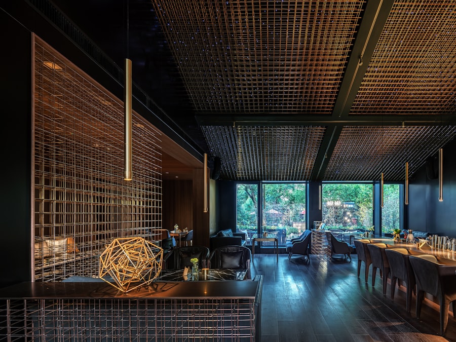 Bar counter with backlit bottles and stools