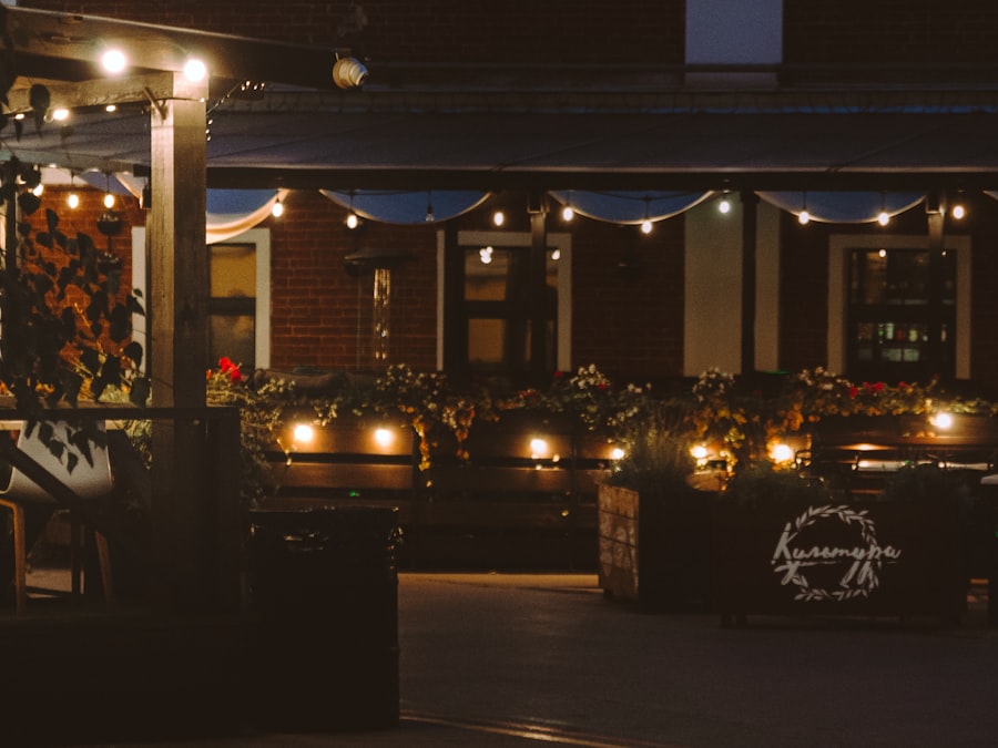 Outdoor terrace seating at night under string lights